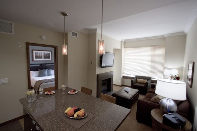 Revelstoke the sutton place hotel 1 bedroom suite living & dining areas.jpg