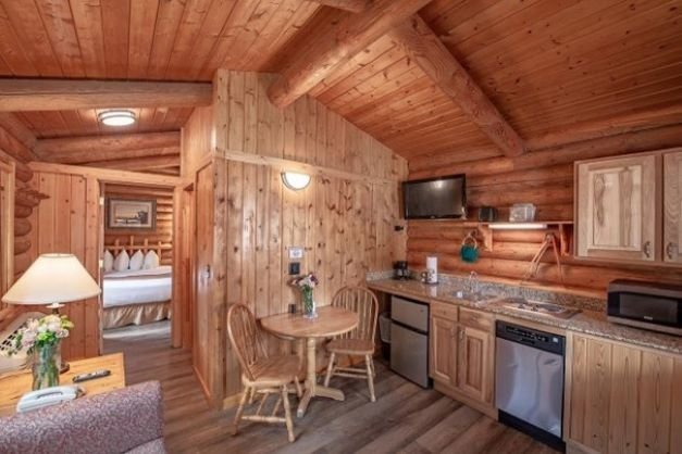 Jackson cowboy village resort double queen deluxe cabin living