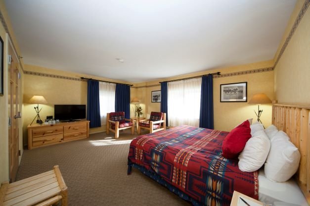 banff brewster's mountain lodge deluxe room with king bed.jpeg