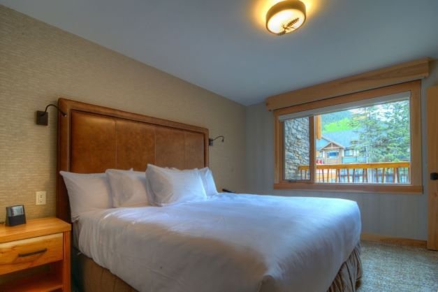 Banff - Moose hotel & suites rooftop 1 bedroom suite bedroom.jpeg