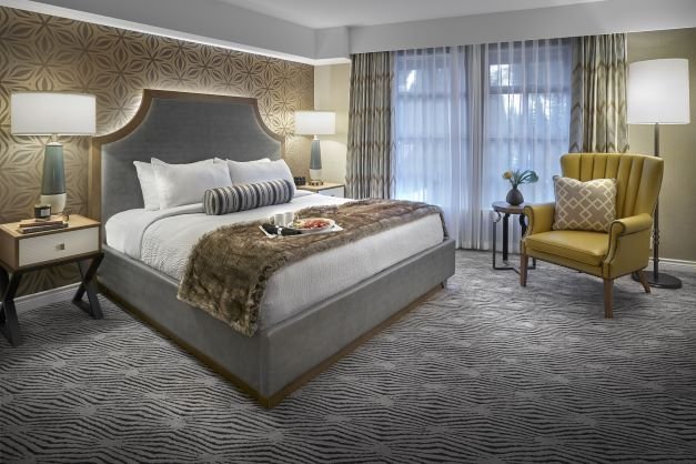 sun peaks grand hotel deluxe room met king bed.jpg
