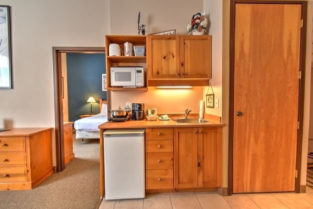 Big White - Inn at big white 1 bedroom living room.jpg