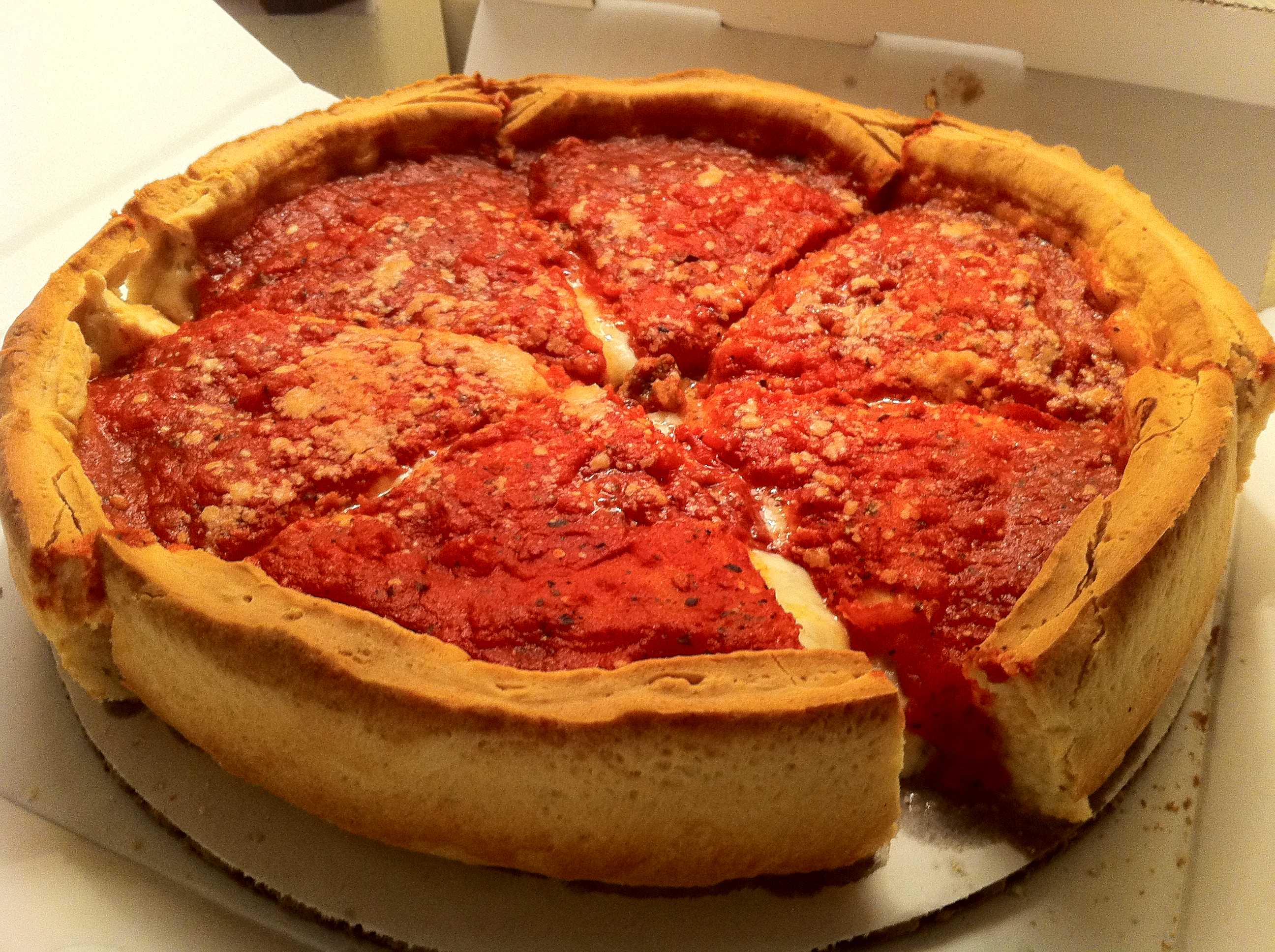 Als je Chicago bezoekt, eet dan een Deep dish pizza, dat is een typische Chicago food traktatie